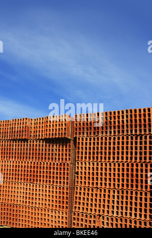 construction bricks stacked red clay brick Stock Photo