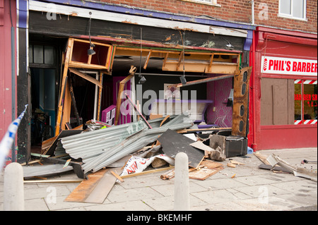 Sunbed shop front smashed after lorry crashed into it Stock Photo