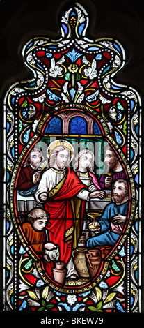 Detail from a stained glass window by Ward and Hughes circa 1865, depicting twelve events from the life of Jesus Christ: Miracle at Cana Stock Photo