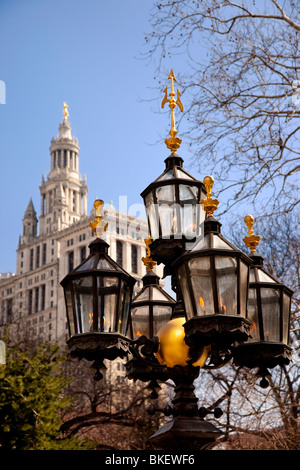 Lamp at City Hall Park with the Municipal Building beyond, New York City USA Stock Photo