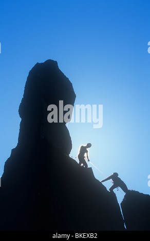 Climbers on Napes Needle, a pinnacle of rock on Great Gable in the Lake district, UK. Stock Photo