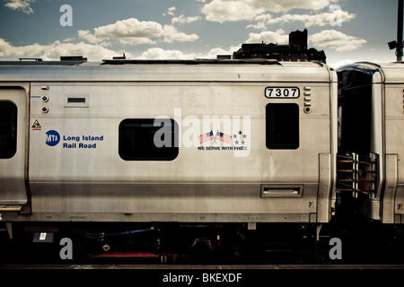 A Long Island Rail coach of the MTA leaves Flushing Rail Station New York USA Stock Photo