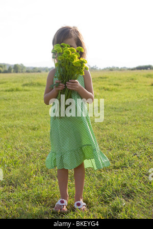 Girl holding bouquet of flowers Stock Photo