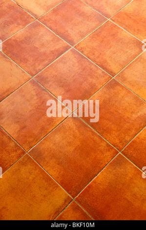 Closeup of square terracotta ceramic tile floor background Stock Photo