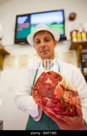 Paul Harrison butchering at Plumgarths farm shop in Kendal, Cumbria, UK Stock Photo