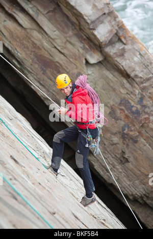 Climbers on a sea cliff climb on Baggy Point near Croyde in north Devon. UK Stock Photo