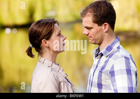 Pretty young couple having a serious talk together Stock Photo