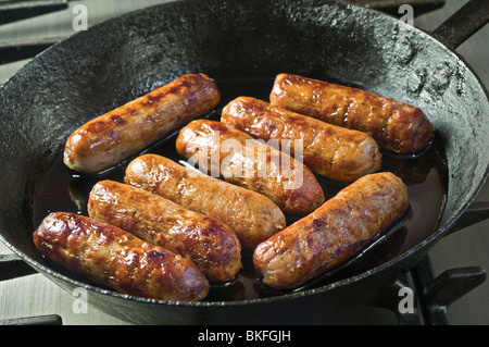 Sausages in frying pan Stock Photo