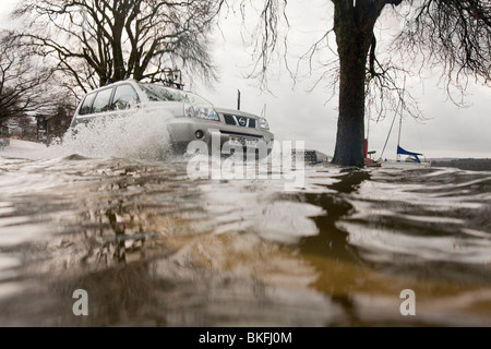 A car in flood waters when Lake windermere reached its highest ever recorded level in the devastating November 2009 floods. Stock Photo