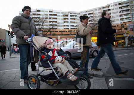 Father pushing a pram, Berlin, Germany Stock Photo