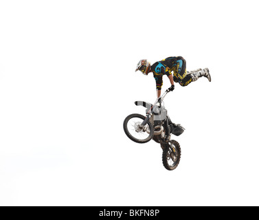 Professional rider at the FMX (Freestyle Motocross) make an acrobatic ...