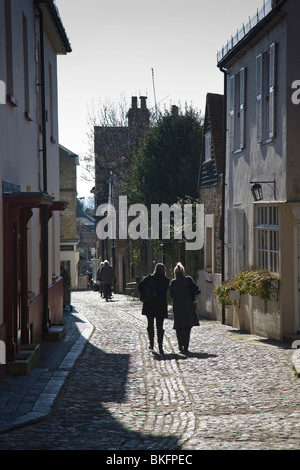 Pedestrians make their way along Lombard Street, Petworth, West Sussex, England. Stock Photo