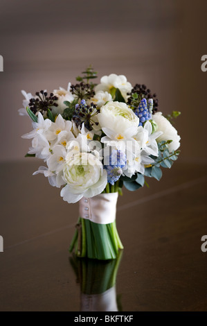 bouquet or posy of spring flowers including ranunculus, daffodil, muscari, hedera Stock Photo