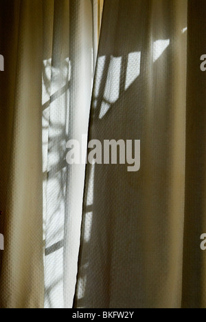 Window light forming an abstract pattern from light through curtain windows HOMER SYKES Stock Photo