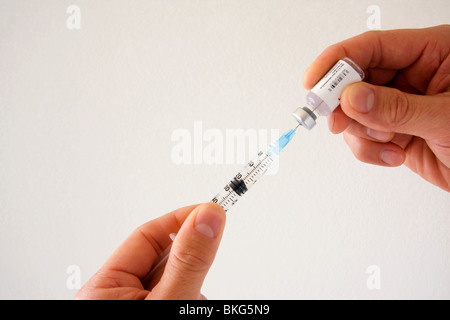 Physician preparing vaccination Stock Photo