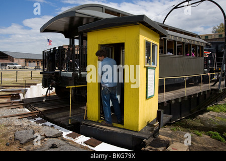 Trackman operating turntable at Roundhouse Railroad Museum, Savannah, Georgia Stock Photo