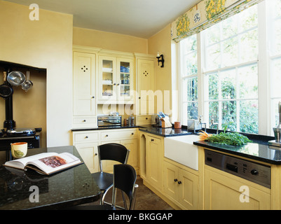 Black Granite Topped Island Unit In Modern Cream Kitchen Painted In Bkggap 