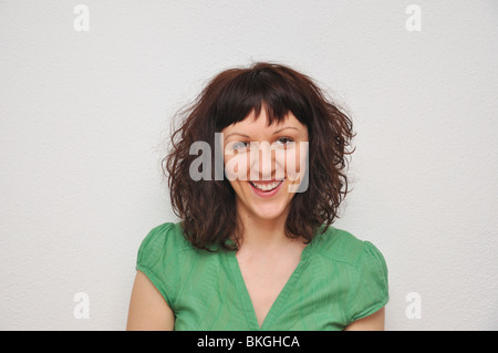 Portrait of a smiling young woman Stock Photo