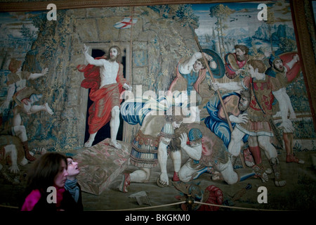 Tourists pass the tapestry titled 'The Resurrection' in the Tapestry Room in the Vatican Museum, Rome, Italy Stock Photo