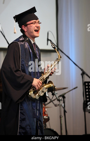 Student playing saxophone at a graduation ceremony at Jacobs University in Bremen, Germany Stock Photo