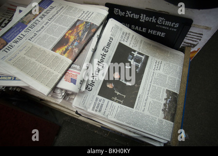 Wall Street Journal and New York Times newspapers are seen on a news stand in New York Stock Photo