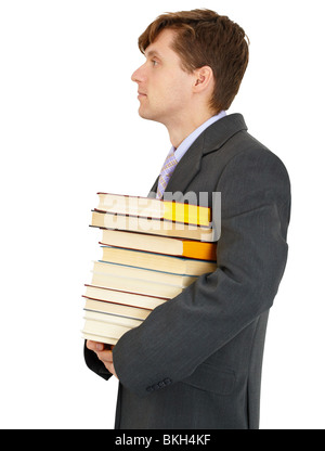 Male student with stack of books at library Stock Photo - Alamy