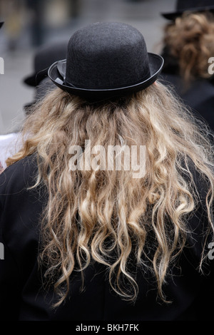 bowler hat blonde hair Stock Photo