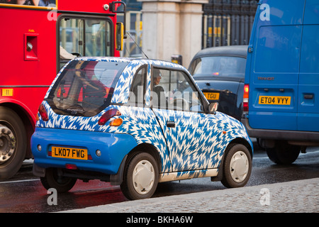 A G-Wiz electric car on the streets of London, UK. Such zero emission vehicles help to combat climate change. Stock Photo