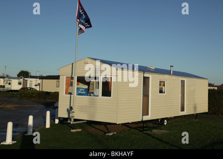 New static caravan holiday home for sale on a busy caravan park Stock Photo