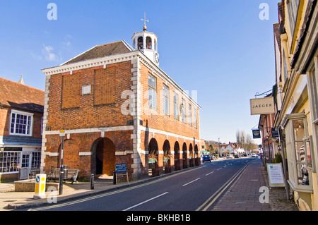 Horizontal wide angle view of the prominent red brick Market Hall in Old Amersham High Street on a sunny day. Stock Photo