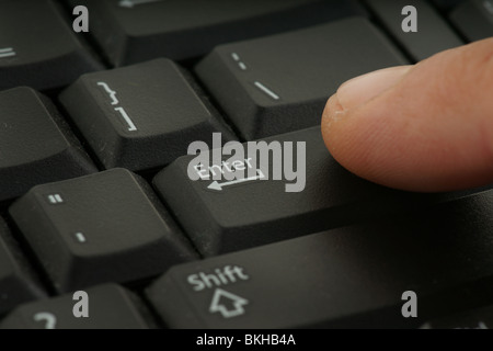 great image of a finger on computer keyboard Stock Photo