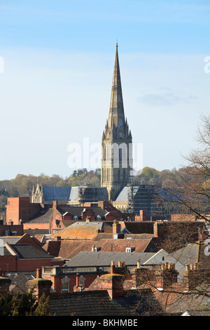 Salisbury Cathedral and spire seen across rooftops in the UK Stock Photo