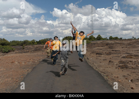 Teenagers having fun running on the way of Wilson point , India. Stock Photo