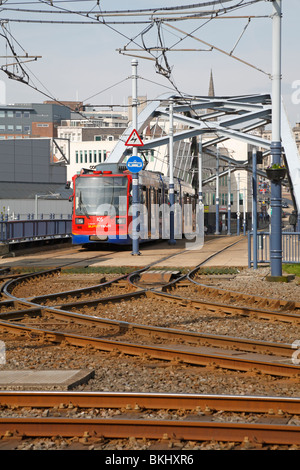 Supertram crossing the new steel bridge at Ponds Forge, Sheffield, South Yorkshire, England, UK. Stock Photo