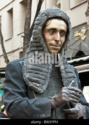 bewigged poet judge street mime hands out poetic justice in historic center of Mexico City Stock Photo
