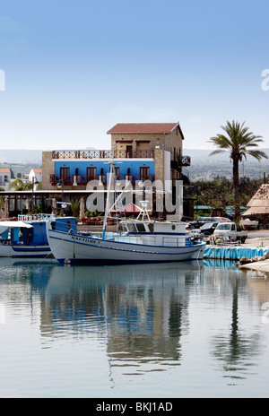 FISHING BOATS AT REST IN THE PICTURESQUE HARBOUR AT LATCHI ON THE ISLAND OF CYPRUS. Stock Photo