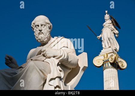 Marble statues of goddess Athena Pallas and the ancient greek philosopher Plato in front of the Academy of Athens Stock Photo