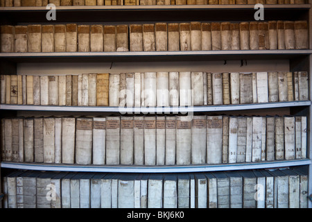Latin books on shelf in corridor outside theological library of Strahov Monastery, Prague, Czech Republic Stock Photo