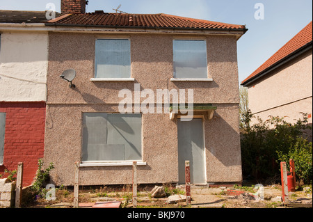 Boarded up empty house UK Stock Photo