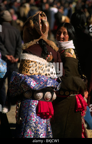 China, Tibet, Gansu province, Xiahé, Labrang monastery, Tibetan New Year's Day, the big thangka ceremony, women wearing the traditional Amdo dress Stock Photo