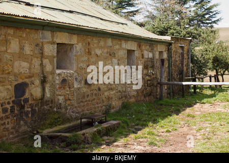Rustic stone cow-shed or byre with corrugated tin roof. Midlands, KwaZulu Natal, South Africa. Stock Photo