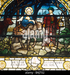 England London Aldersgate St. Botolph's church Stained glass window depicting scene of the Flight into Egypt by A.K. Nicholson Stock Photo