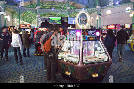 Amusement arcade people and machines Brighton pier England UK Stock Photo