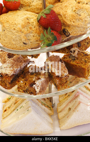 cake stand with Strawberries and scones, Walnut cake sponge, ham and egg sandwiches desert Wedding breakfast table Rufford wedding facilities, Rufford Mill Stock Photo