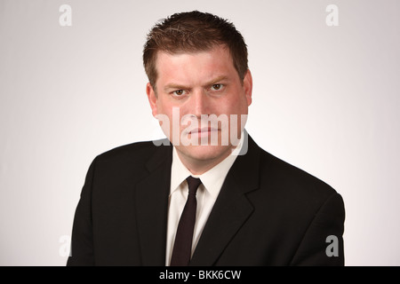 Serious business man wearing black suit and tie.  © Katharine Andriotis Stock Photo