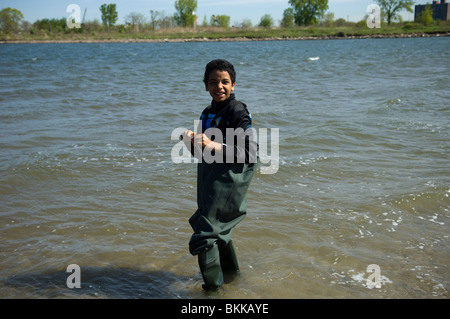 Students test the water quality and search the waters for marine life at Coney Island Creek in Brooklyn in New York Stock Photo