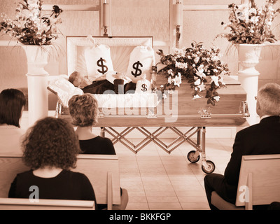 The Deceased Laying In A Coffin At His Funeral With Bags Of Money Surrounding Him Stock Photo