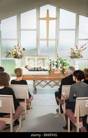 The Deceased Laying In A Coffin At His Funeral Stock Photo