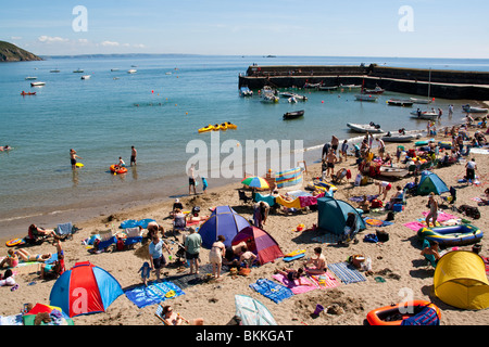 Crowds of people on the beach at Gorran Haven Cornwall England Stock Photo