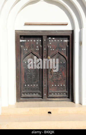 traditional wooden door in the village of Sur, Sultanate of Oman. Photo by Willy Matheisl Stock Photo